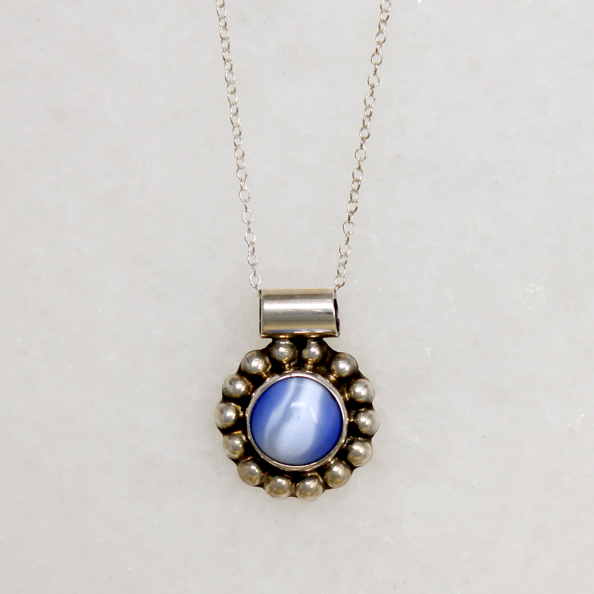 Cheerful Blue Art Glass in Silver Petaled Pendant