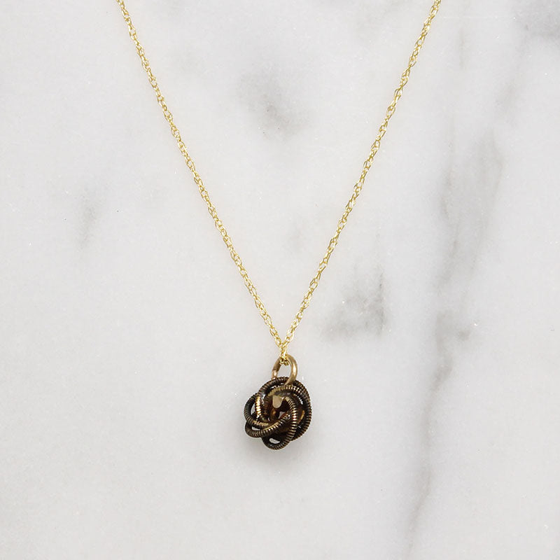Engraved Gold & Garnet Love Knot Necklace