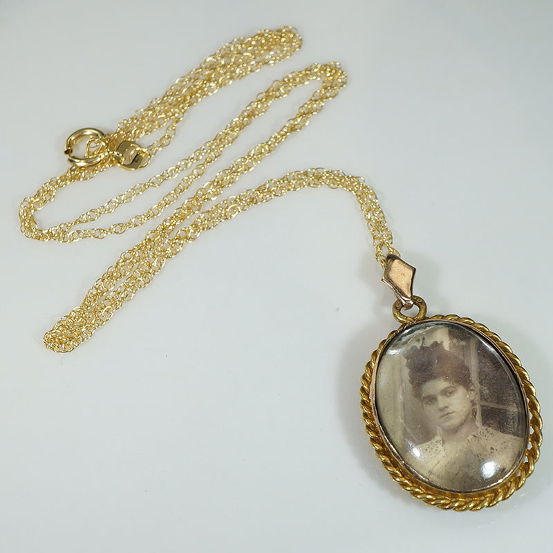 Serious Young Woman in Crystal & Gold Locket