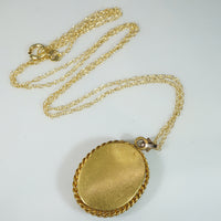 Serious Young Woman in Crystal & Gold Locket
