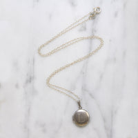 Capital "L" Tiny Round Silver Locket
