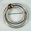 Luxurious Silver Circle Brooch with 18k & Ruby by Tiffany & Co.