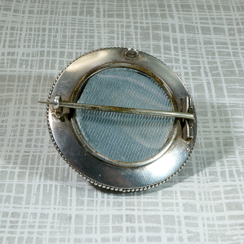 Grand Period Sterling Locket Brooch with Engraved Crane