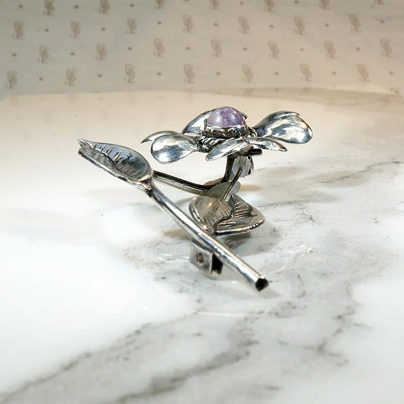 Playful Silver Flower Brooch with Amethyst Pistil