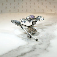Playful Silver Flower Brooch with Amethyst Pistil