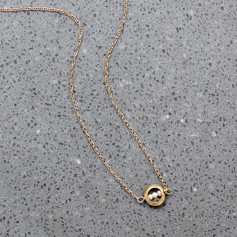 Dainty White Pearls in Gold "O" Necklace by brunet