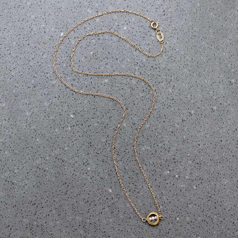Dainty White Pearls in Gold "O" Necklace by brunet