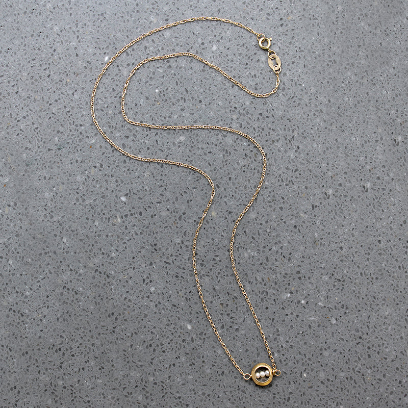 Dainty White Pearls in Gold "O" Necklace by brunet