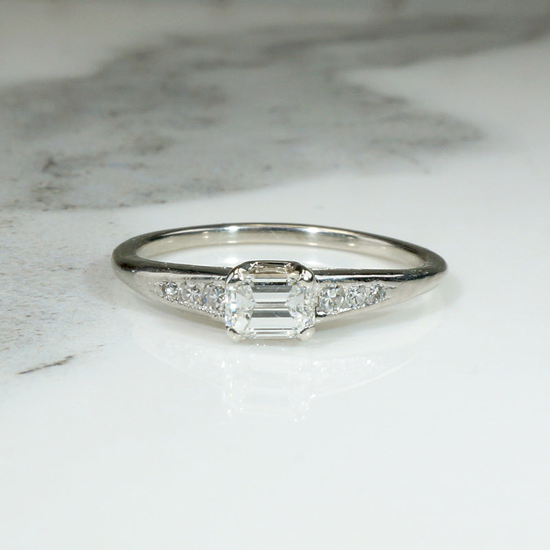 Refined Mid Century Emerald Cut Diamond Engagement Ring