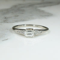 Refined Mid Century Emerald Cut Diamond Engagement Ring