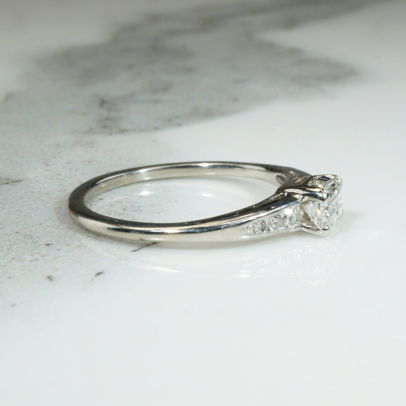 Refined Mid Century Emerald Cut Diamond Engagement Ring