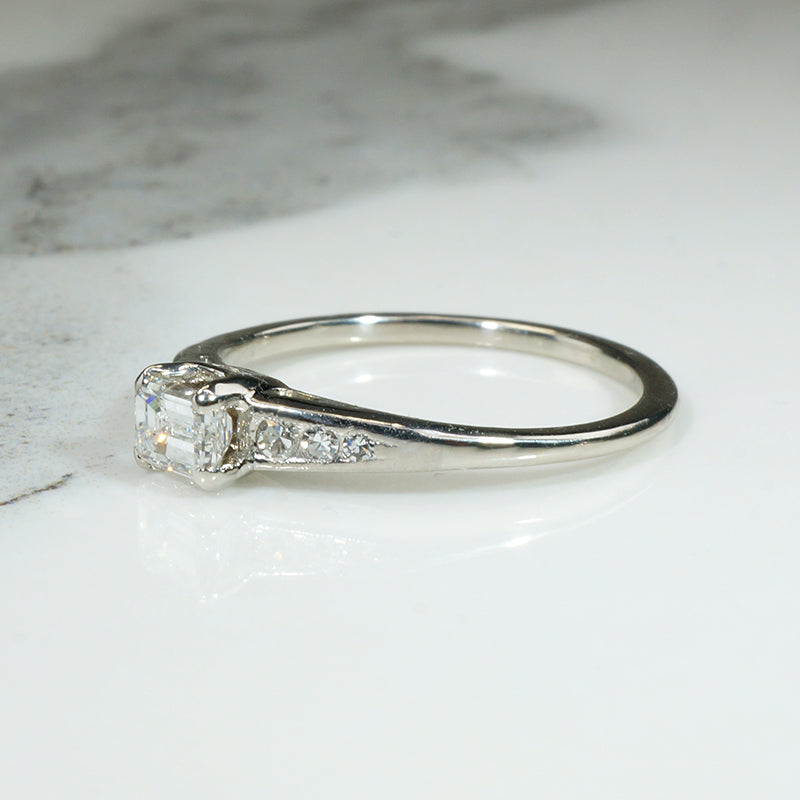 Refined Mid Century Emerald Cut Diamond Engagement Ring