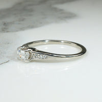 Refined Mid Century Emerald Cut Diamond Engagement Ring