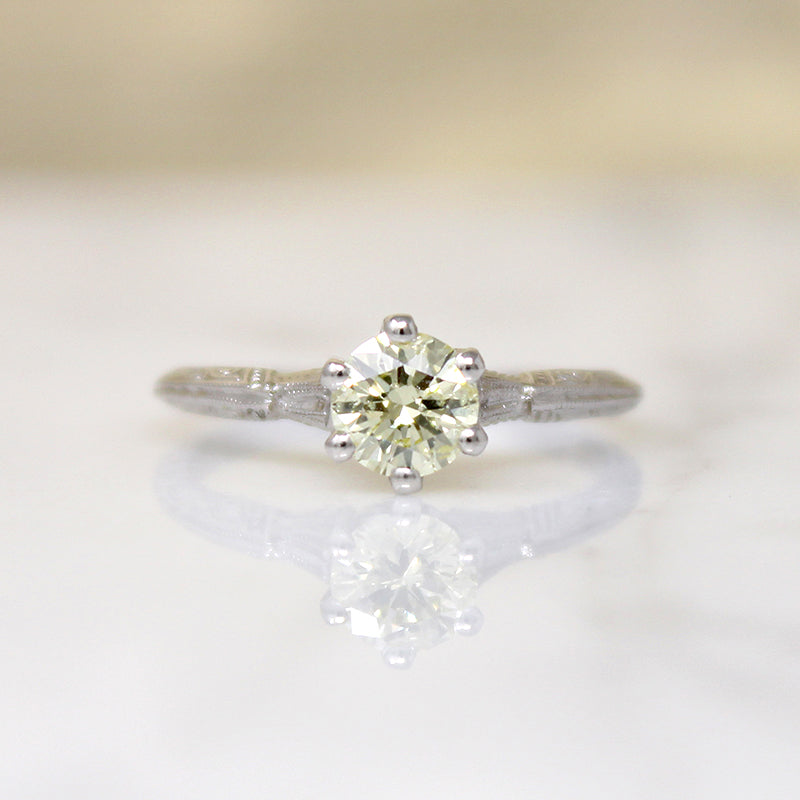 Delightful Yellow Diamond in Engraved Platinum Solitaire