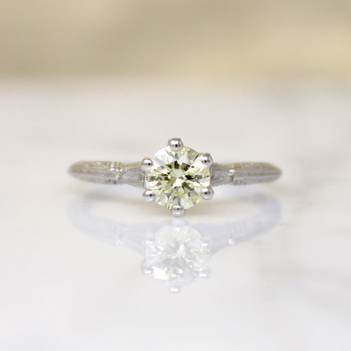 Delightful Yellow Diamond in Engraved Platinum Solitaire