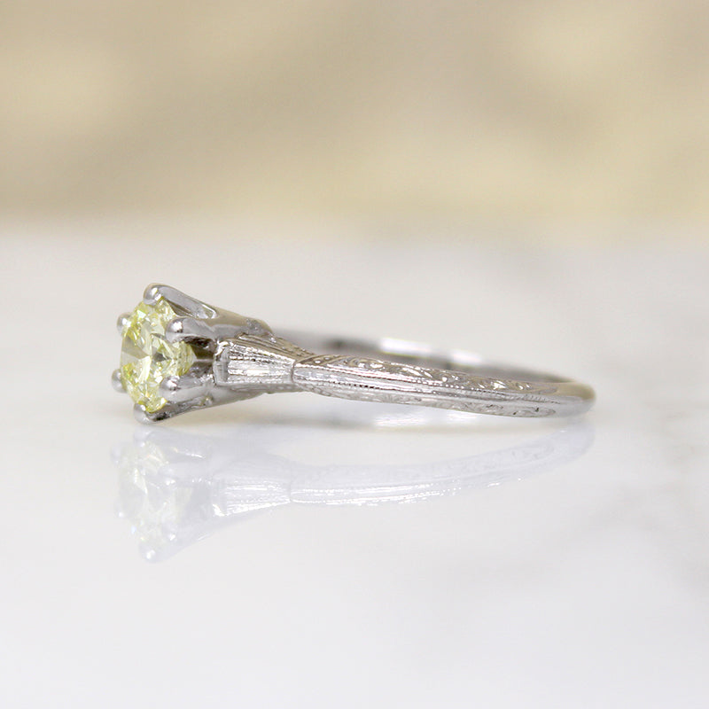 Delightful Yellow Diamond in Engraved Platinum Solitaire