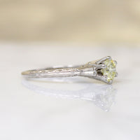 Delightful Yellow Diamond in Engraved Platinum Solitaire