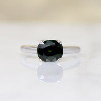 Deep Green Cushion Cut Sapphire in Platinum Solitaire