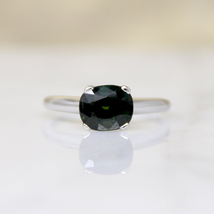Deep Green Cushion Cut Sapphire in Platinum Solitaire