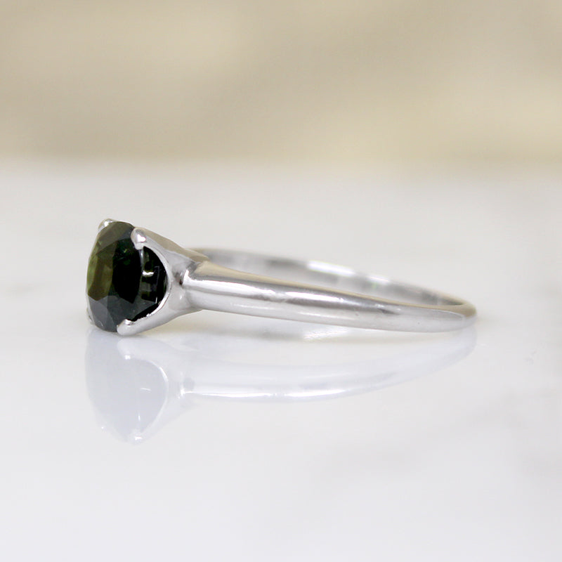 Deep Green Cushion Cut Sapphire in Platinum Solitaire