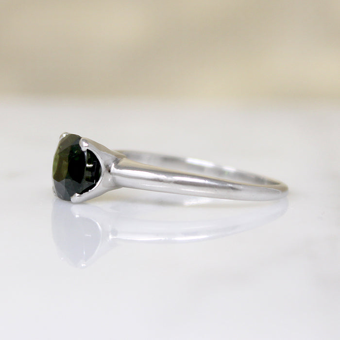 Deep Green Cushion Cut Sapphire in Platinum Solitaire