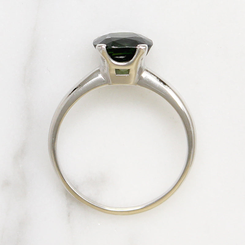 Deep Green Cushion Cut Sapphire in Platinum Solitaire