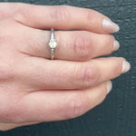 Refined Mid-Century Emerald Cut Diamond Engagement Ring