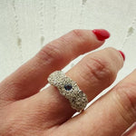A Trio of Flowers Diamonds and Sapphire Ring