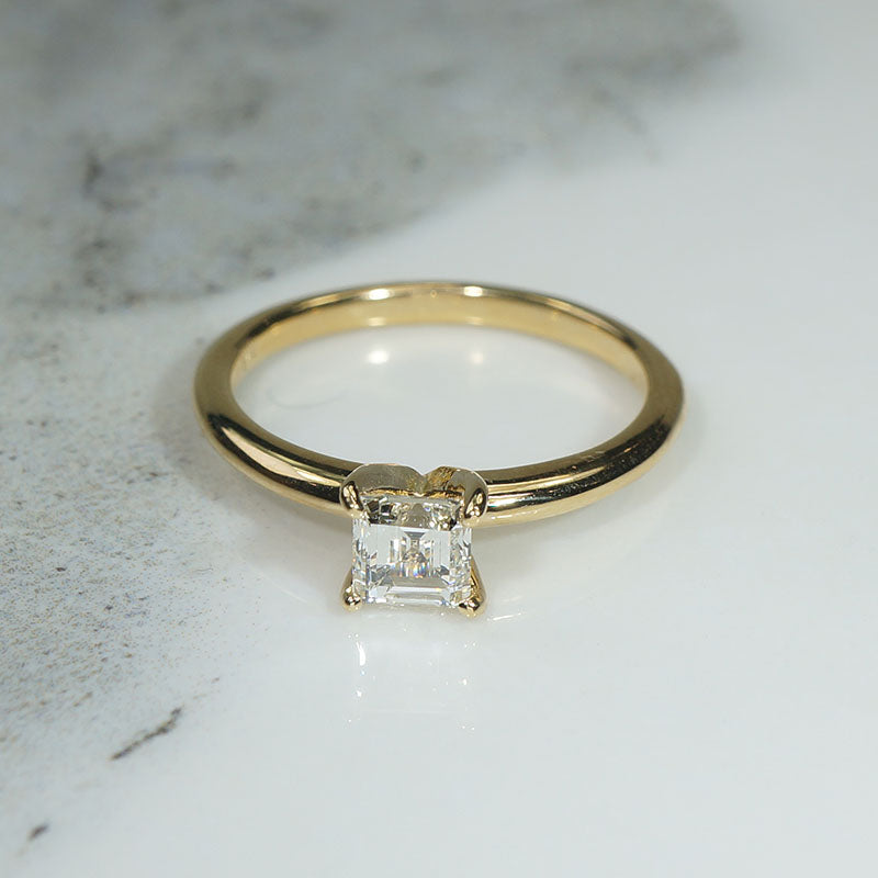 Exquisite Step-Cut Diamond in Gold Solitaire by 720