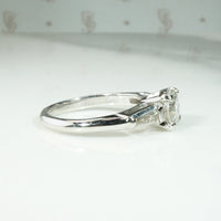 Elegant Platinum Engagement Ring with Baguette Accents