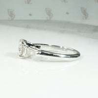 Elegant Platinum Engagement Ring with Baguette Accents