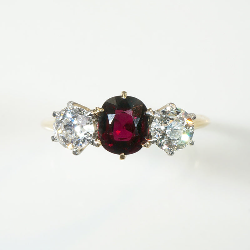 Incredible Ruby in Trilogy Ring with Dazzling Diamonds