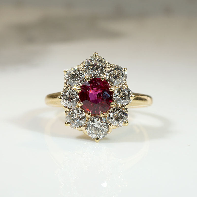 Smouldering Oval Ruby in Diamond Halo Ring