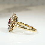 Smouldering Oval Ruby in Diamond Halo Ring