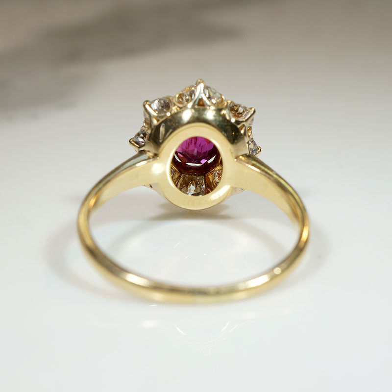 Smouldering Oval Ruby in Diamond Halo Ring