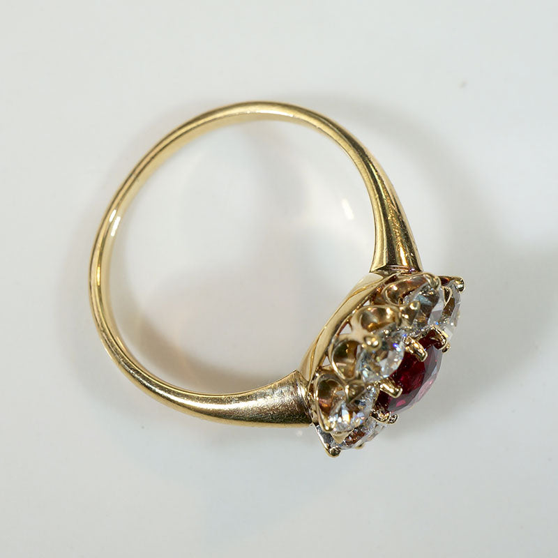 Smouldering Oval Ruby in Diamond Halo Ring