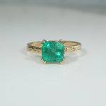 Enchanting Emerald in Engraved Gold Solitaire Ring