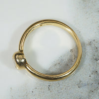 Oval Diamond Bezel Set in Buttery Gold Solitaire Ring