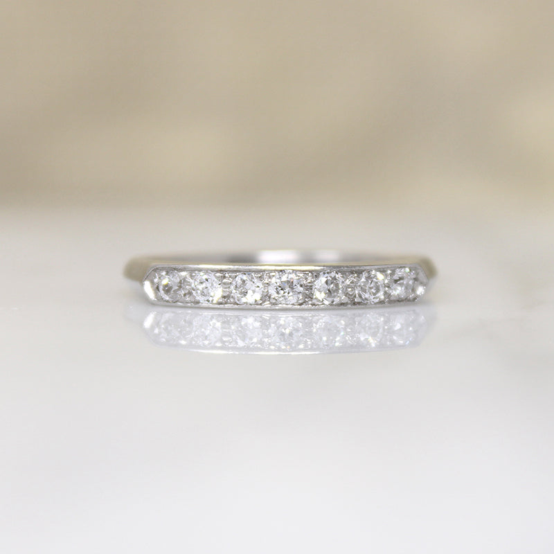 Chic & Sleek Seven Diamond Platinum Wedding Band