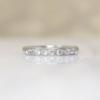 Chic & Sleek Seven Diamond Platinum Wedding Band