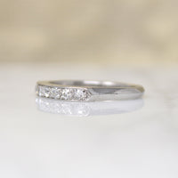 Chic & Sleek Seven Diamond Platinum Wedding Band