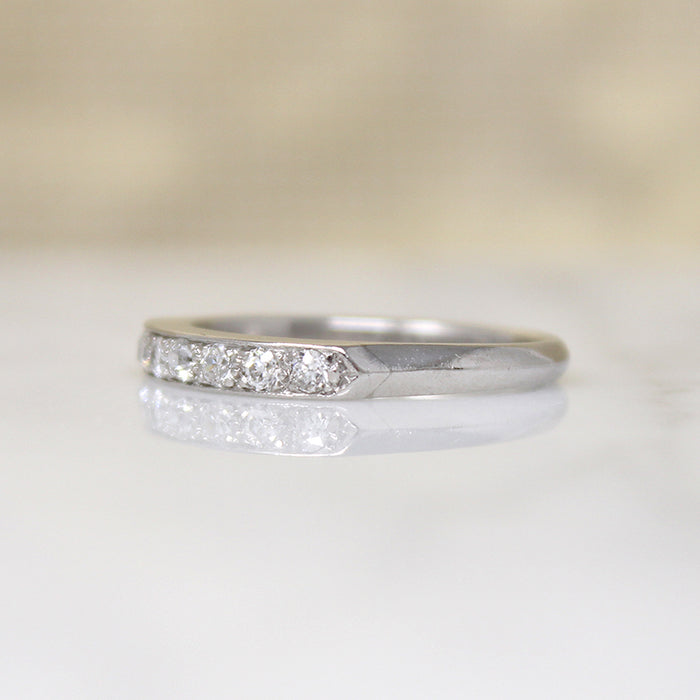 Chic & Sleek Seven Diamond Platinum Wedding Band