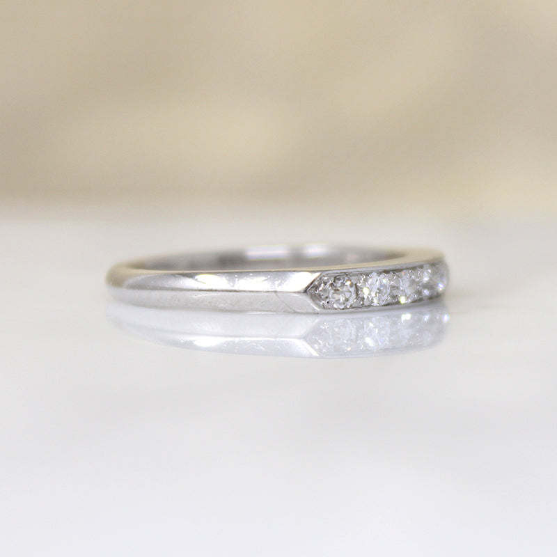 Chic & Sleek Seven Diamond Platinum Wedding Band