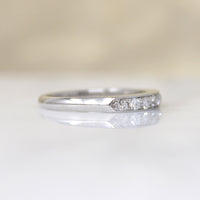 Chic & Sleek Seven Diamond Platinum Wedding Band