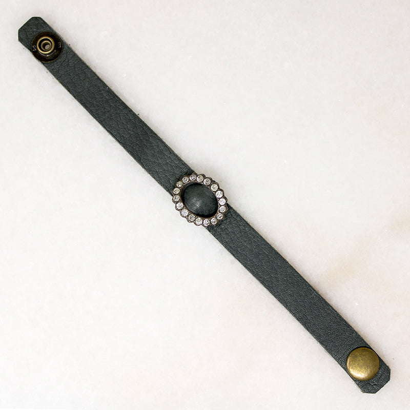 Title
Green Leather & Paste Buckle Bracelet by Ancient Influences
