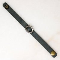 Title
Green Leather & Paste Buckle Bracelet by Ancient Influences
