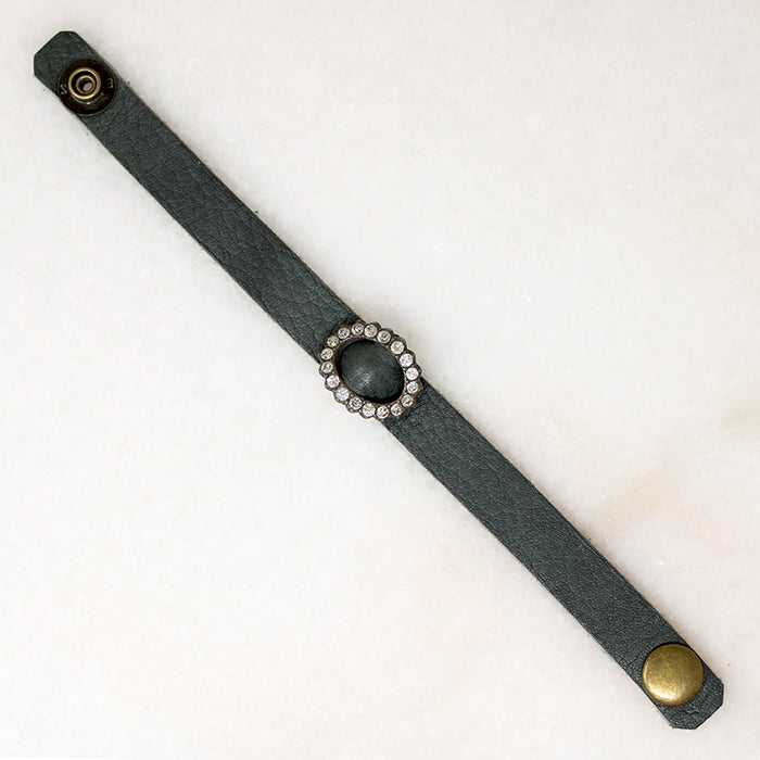 Title
Green Leather & Paste Buckle Bracelet by Ancient Influences
