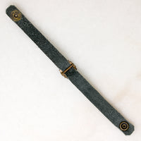 Title
Green Leather & Paste Buckle Bracelet by Ancient Influences

