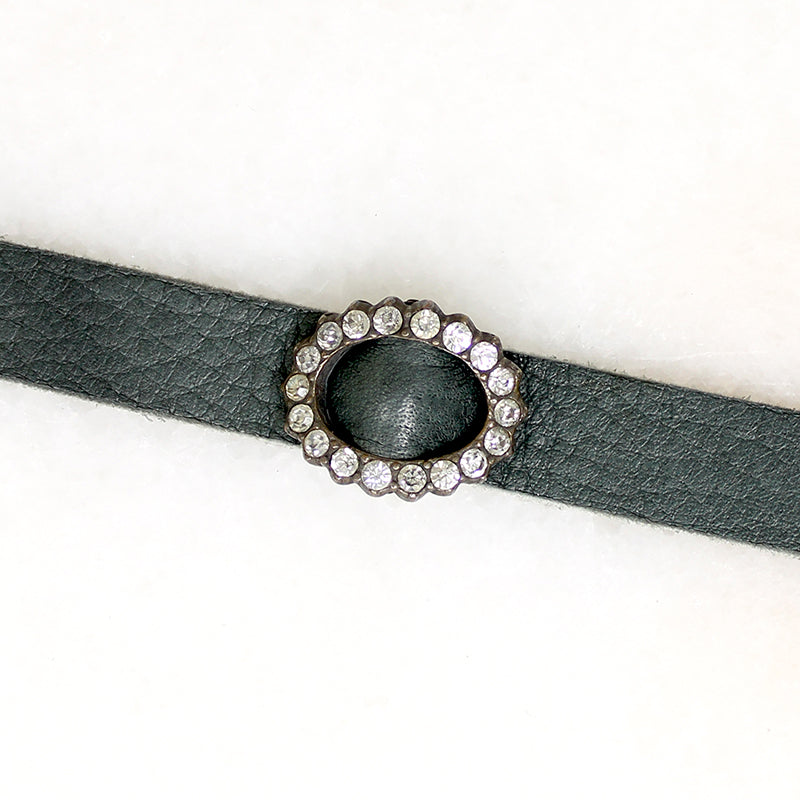 Title
Green Leather & Paste Buckle Bracelet by Ancient Influences
