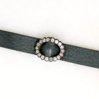 Title
Green Leather & Paste Buckle Bracelet by Ancient Influences
